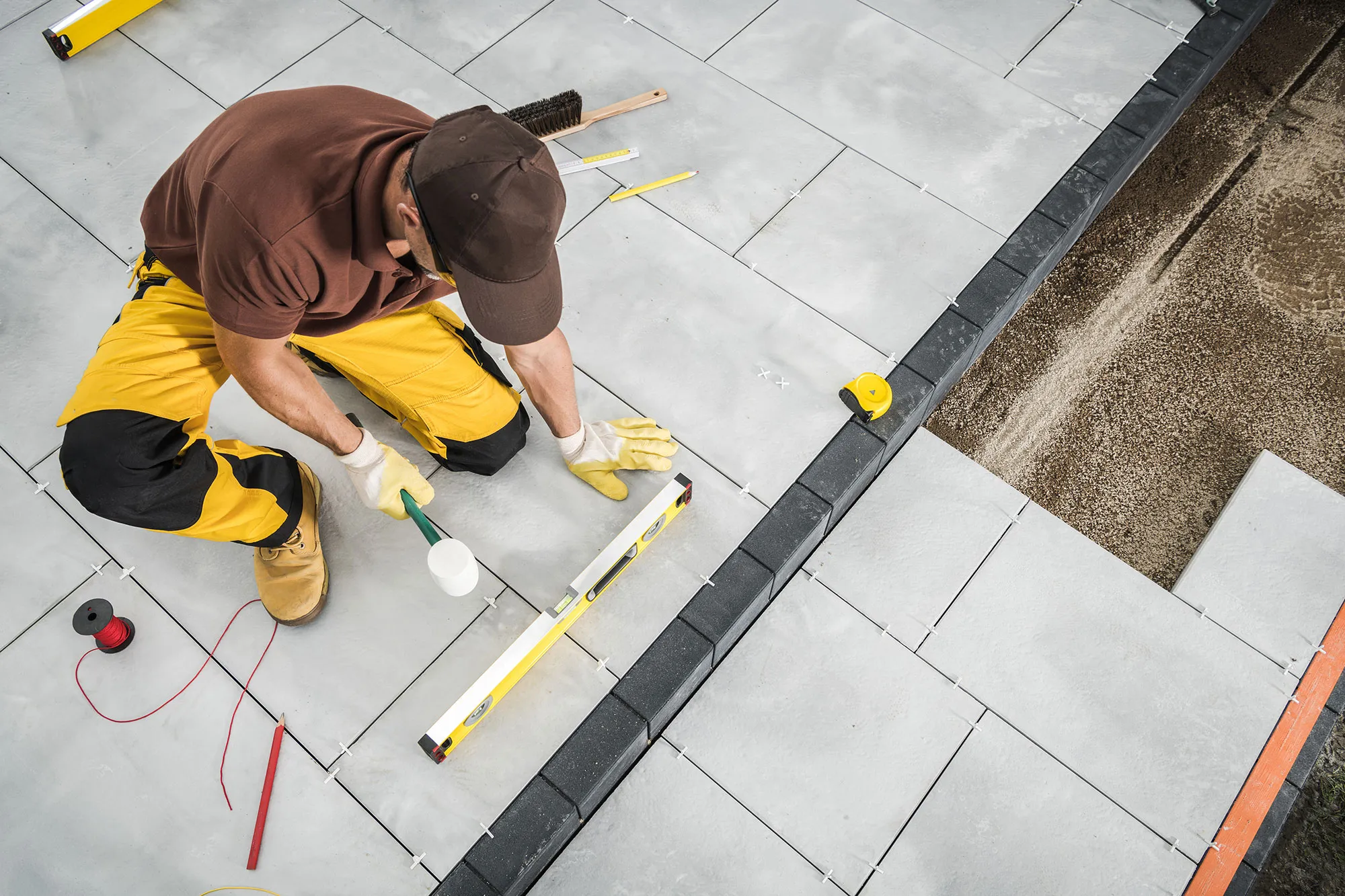 installing-paving-bricks-patio-floor-2022-10-24-18-43-37-utc.webp