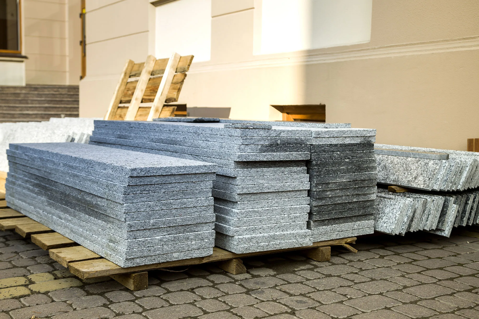piles-of-granite-marble-slabs-stone-sheets-for-de-2022-03-16-00-15-09-utc.webp